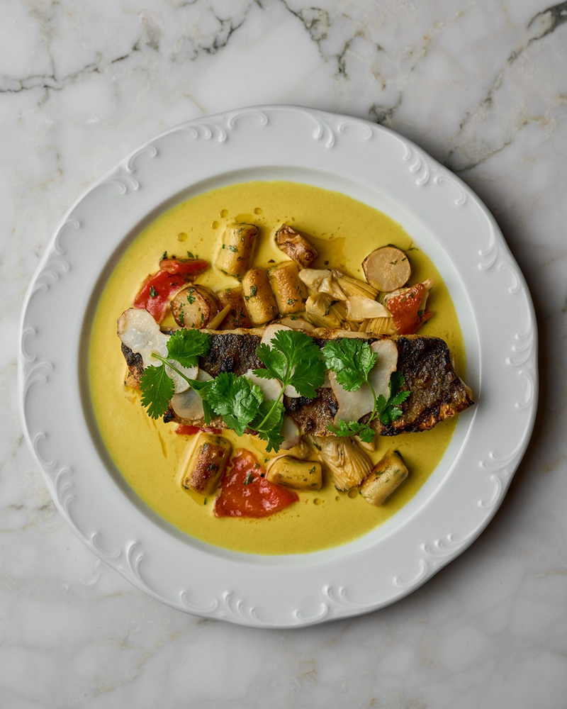 Colorful dish with fish and vegetables