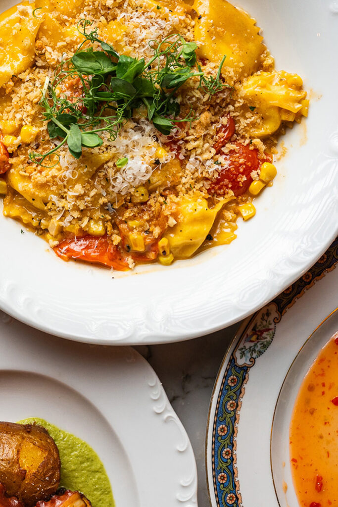 Creamy pasta with herbs and toppings