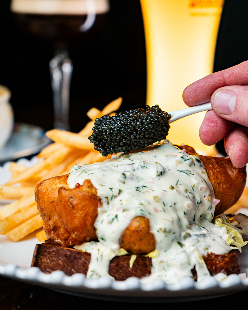 Fried food topped with caviar and sauce