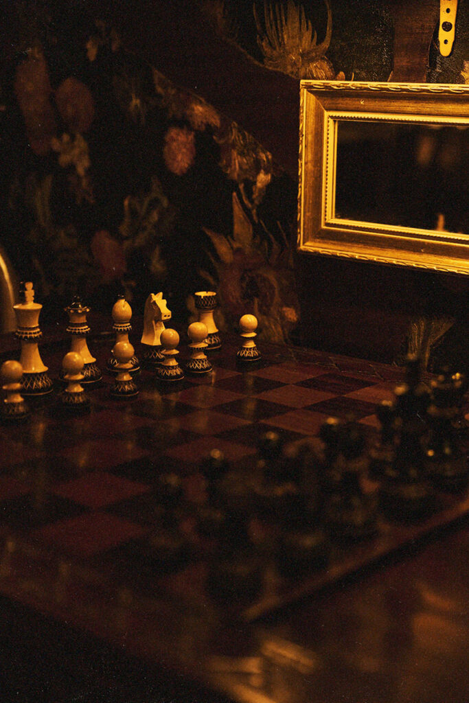 Chessboard with pieces and mirror