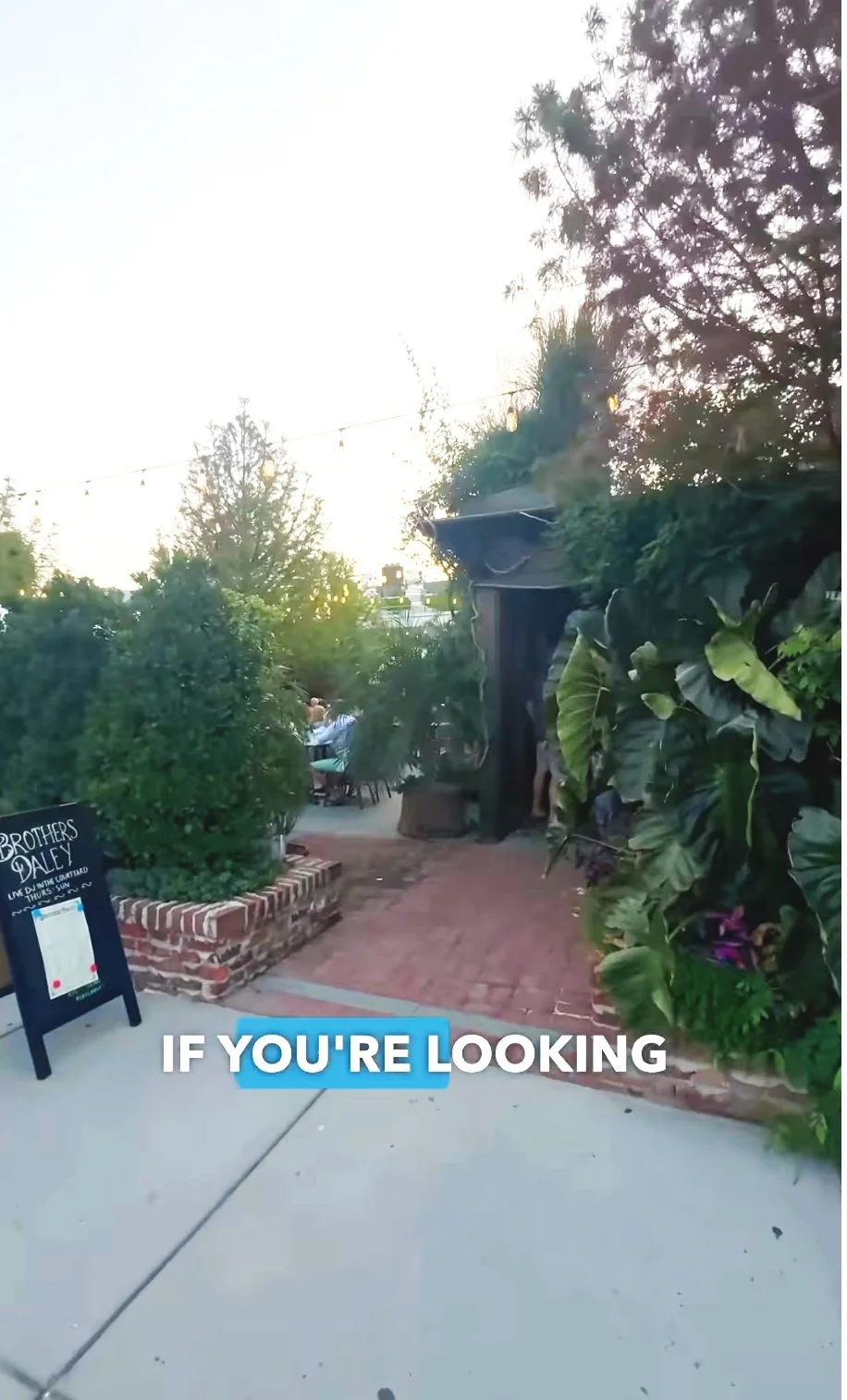 Entrance to a lush outdoor dining area