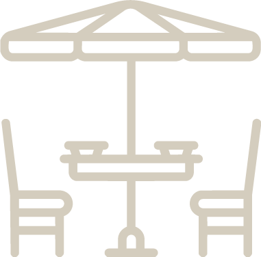 Table and chairs under an umbrella